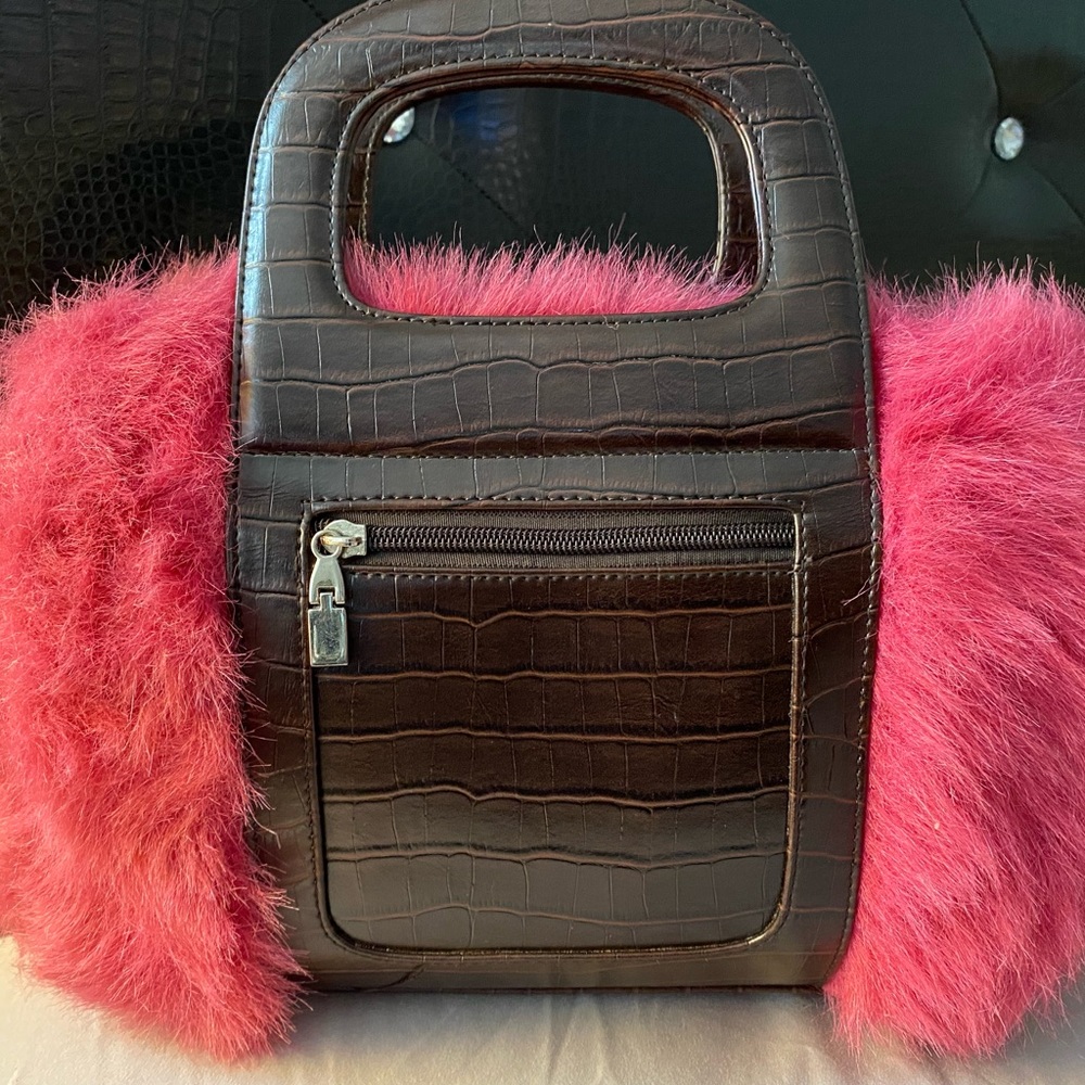 Faux purse in the color pink and dark brown.